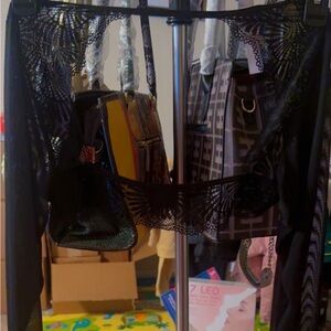 Long sleeve mesh bolero with galoon lace side and back panels, and back opening.